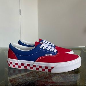 Red white and blue lace up Vans shoes with checker pattern. Men’s US 8
